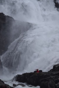 Closer up picture of the woman at the falls