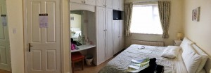 This is our B&B room.  Can you find the bathroom?  It is through the wardrobe doors!